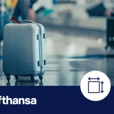 Srebrna walizka, idealna jako lufthansa bagaż podręczny, stoi na lotniskowym pasie. Obok ikony wymiarów i wagi.