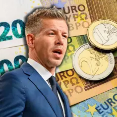 Mężczyzna w garniturze na tle banknotów euro i monet. Czy na Węgrzech można płacić euro?